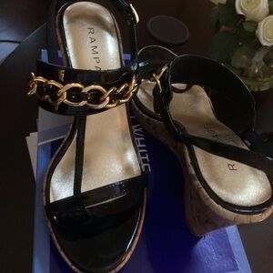 White Mountain Black patent wedge with gold chain detail.